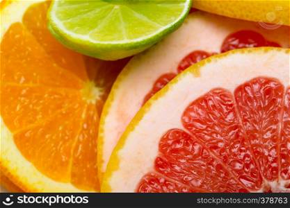 citrus background - lime, lemon, orange, grapefruit