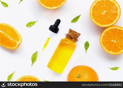Citrus essential oil with fresh orange fruit isolated on white background.