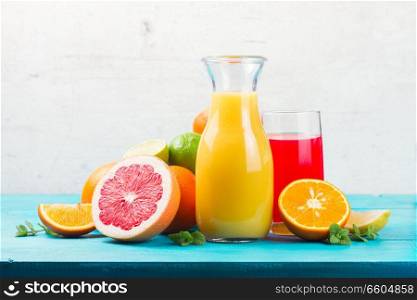 Citrus fresh juices - red and yellow one with oranges and grapefruits. Citrus juices