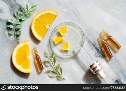 Citrus fruit vitamin c serum oil beauty care, anti aging natural cosmetic, laboratory creating anf testing concept. Citrus fruit vitamin c serum oil beauty care