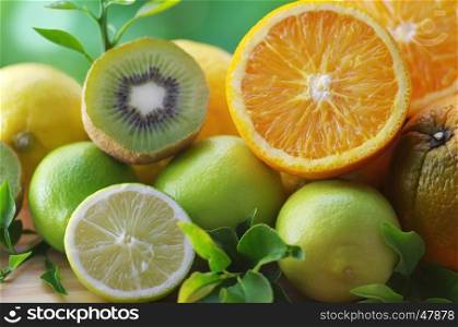 Citrus fruits, kiwis and leaves