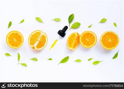 Citrus fruits oil natural orange Vitamin C with fresh orange and green leaves on white background.