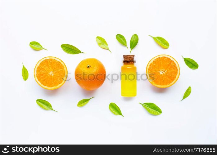Citrus fruits oil natural orange Vitamin C with fresh orange and green leaves on white background.