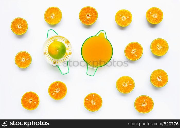 Citrus orange juicer with half-cut oranges on white background. Copy space