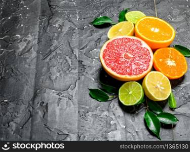 Citrus with leaves. On rustic background. Citrus with leaves.