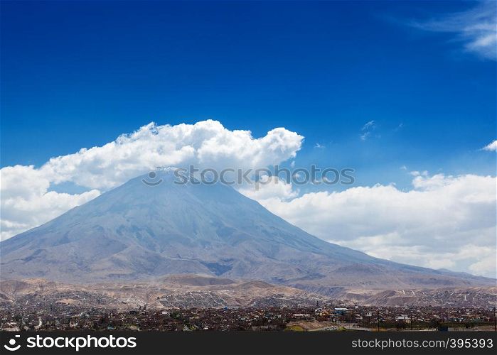 city and the volcano on a background of sky