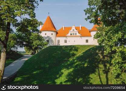 City Bauska, Latvia Republic. Park with old castle and river. Trees and green zone. Sep 9. 2019 Travel photo.