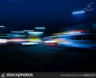 City blur view cityscape with office building landscape at night. Abstract urban night defocused background.. Defocused shot of abstract light bokeh night city background