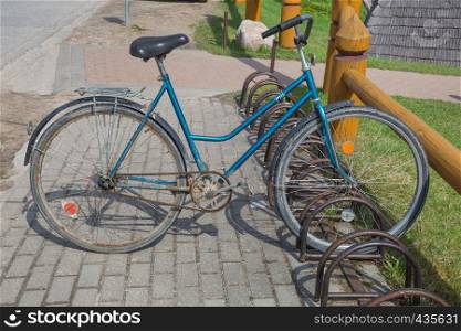 City Brenguli, Latvia. Old Ussr vintage retro bicycle at spring. Travel photo. 2018