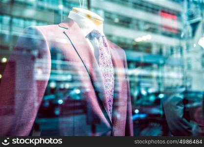 City business people lifestyle concept. Fast city life in window reflection from suit store on Wall street.