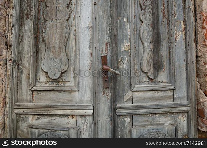 City Cesis, Latvia Republic. Old wooden door with handle. 2. November.