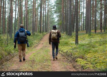 City Cesis, Latvia republic. Two photographers walk through the forest and enjoy the beauty of nature. 2. november.