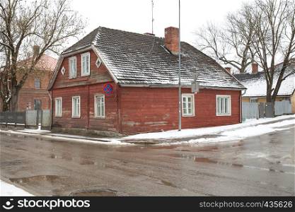 City Cesis, Latvia. Street and old wooden house, urban city space. Winter 2018. Travel photo.