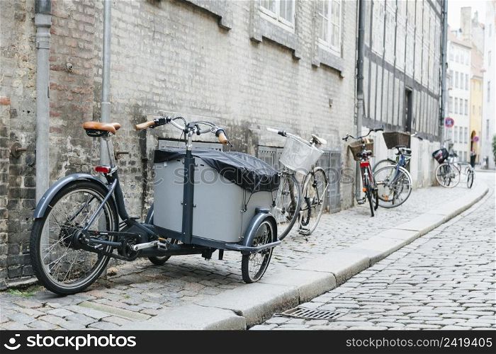 city cobbled sidewalk with bicycles