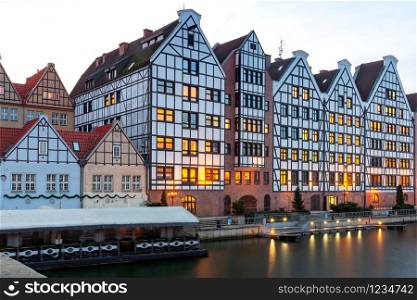 City embankment and facades of medieval houses in the old city at dawn. Gdansk. Poland.. Gdansk. City embankment at dawn.