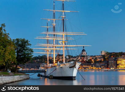 City embankment in the evening illumination at sunset. Stockholm. Sweden.. Stockholm. City embankment at sunset.