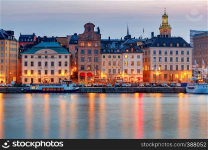 City embankment in the evening illumination at sunset. Stockholm. Sweden.. Stockholm. City embankment at sunset.