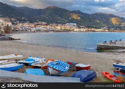 City embankment in the old medieval town of Cefalu at dawn. Italy. Sicily.. Cefalu. Sicily. Old city.