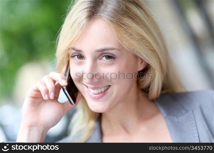 City girl talking on mobile phone in the street