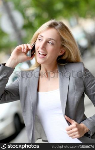 City girl talking on mobile phone in the street