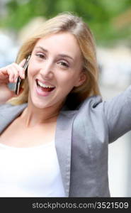 City girl talking on mobile phone in the street