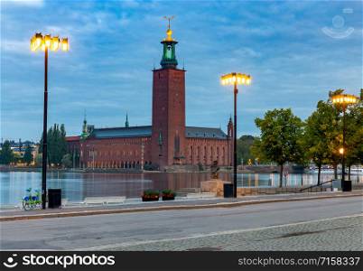 City Hall on the waterfront in the night lighting. Stockholm. Sweden.. Stockholm. City Hall on the sunset.