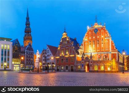 City Hall Square with House of the Blackheads and Saint Peter church in Old Town of Riga at night, Latvia
