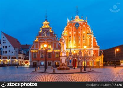 City Hall Square with House of the Blackheads and Saint Roland Statue in Old Town of Riga during evening blue hour, Latvia