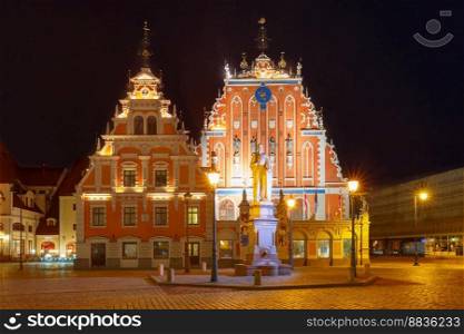 City Hall Square with House of the Blackheads and Saint Roland Statue in Old Town of Riga at night, Latvia. City Hall Square in the Old Town of Riga, Latvia