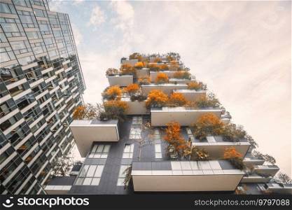 City in beautiful autumn colors on tall buildings with trees and plants