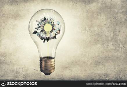 City in Bulb. Glass light bulb and city concept inside