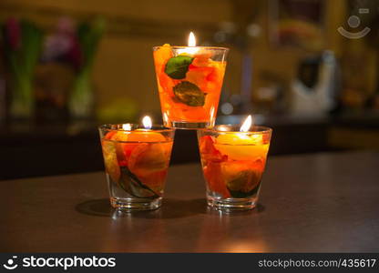 City Jekabpils, Latvia. Candles light and rose leafs inside in glass bowl. Travel photo 2018.