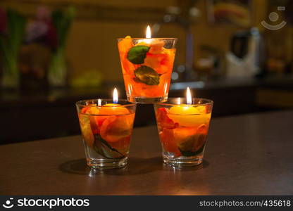 City Jekabpils, Latvia. Candles light and rose leafs inside in glass bowl. Travel photo 2018.