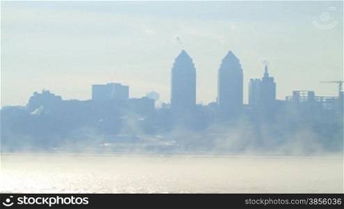 City landscape in cold and foggy morning. kind through river Dnepr.