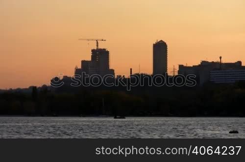 City landscape with skyscrapers on river Dnepr.