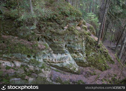 City Liepa, Latvia. Old rocks and area at wood. Peoples travel and green nature at spring. Travel photo 2018.