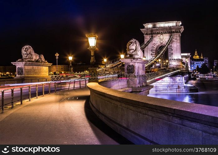 City of Budapest in Hungary night urban scenery, street on the Szechenyi Chain Bridge (Hungarian: Szechenyi lanchid).
