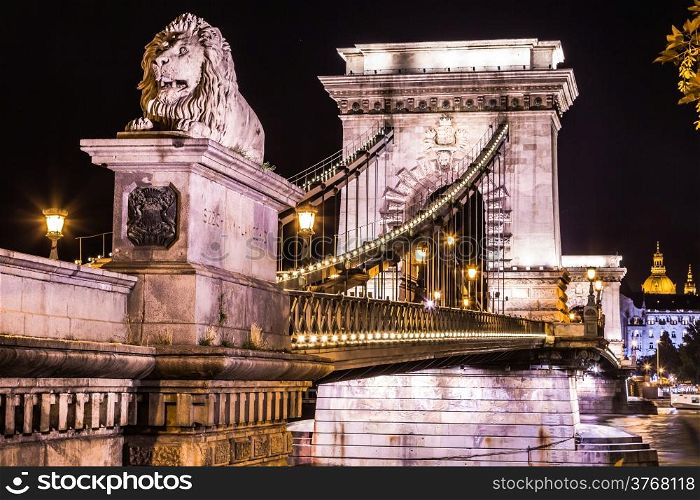 City of Budapest in Hungary night urban scenery, street on the Szechenyi Chain Bridge (Hungarian: Szechenyi lanchid).