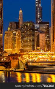 City of Chicago downtown and Chicago River sunset night in Chicago Illinois USA.