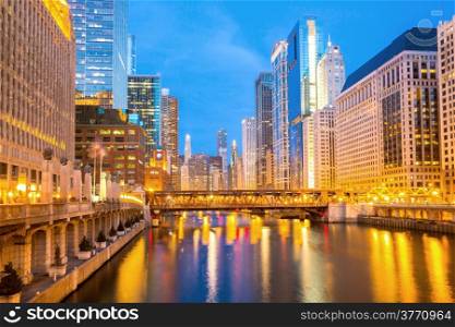 City of Chicago downtown and River with bridges at dusk.