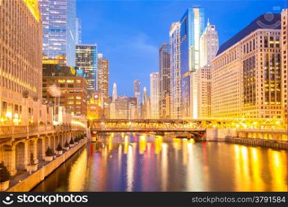City of Chicago downtown and River with bridges at dusk.