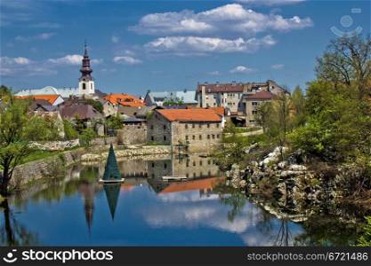 City of Gospic river reflections, Lika region, Croatia