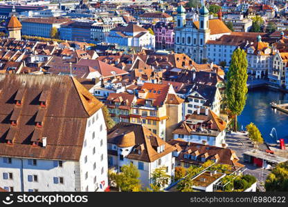 City of Luzern riverfront and rooftops aerial view, Alps landscape of Switzerland