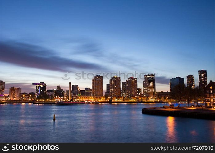 City of Rotterdam river view at twilight in Netherlands, South Holland province.