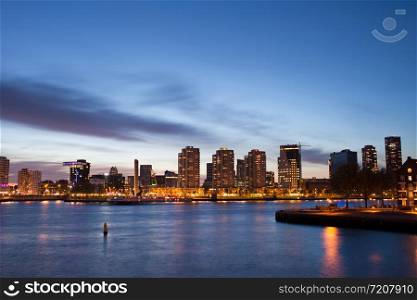 City of Rotterdam river view at twilight in Netherlands, South Holland province.