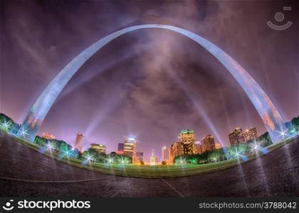 City of St. Louis skyline. Image of St. Louis downtown with Gateway Arch at twilight.