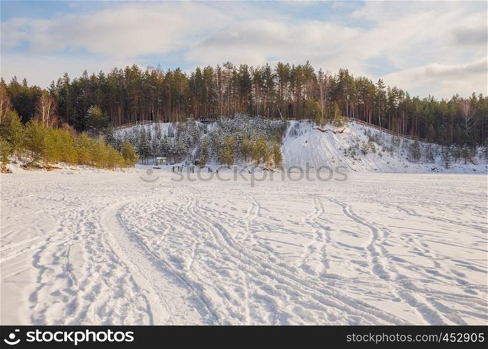 City Ogre, Latvia. Peoples and old sand quarry at city Ogre. Snow and ice, nature photo. Travel photo at Latvia. 2018