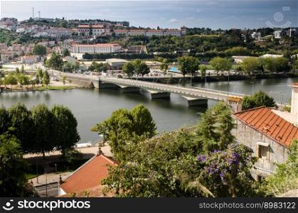 City panorama of Coimbra, Portugal and the river Mondego.