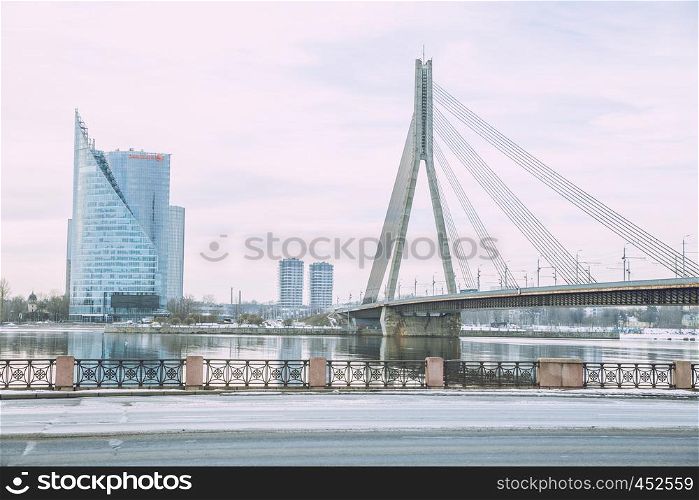 City Riga, Latvia. Old city streets, tourists and architecture. Old bridge, streets and urban view. Travel photo 2019. february.Winter, snow and cold.