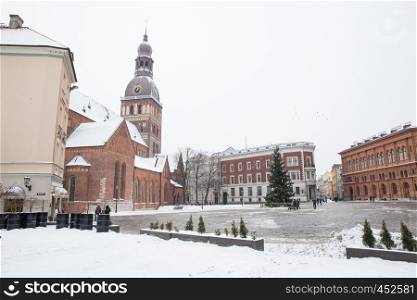 City Riga, Latvia. Old city streets, tourists and architecture. Old houses, streets and urban view. Travel photo 2019. january.Winter, snow and cold.